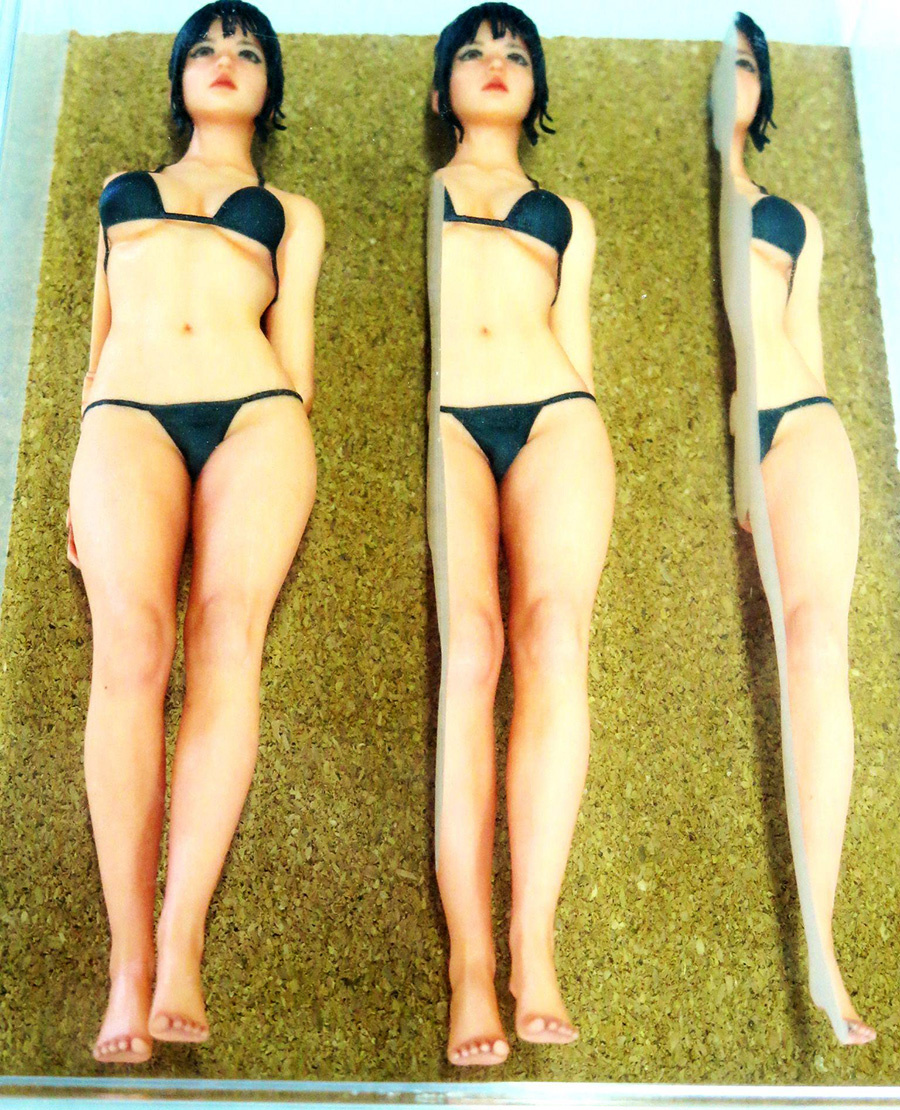 The character JOY, created by an overseas CG creator, is used as a mascot to explain the mechanism of 3D printing with a figure.